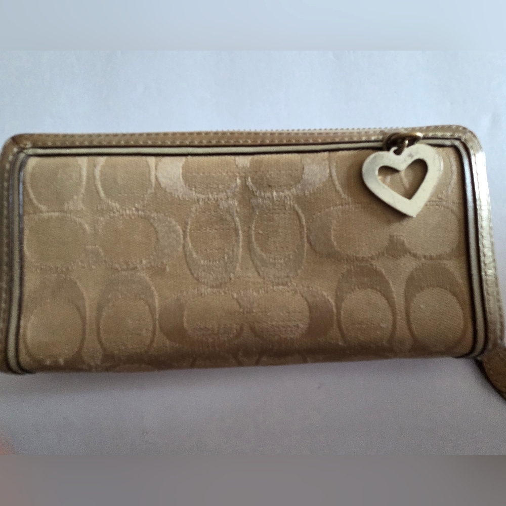 COACH PREOWNED ZIPAROUND GOLD WALLET.
